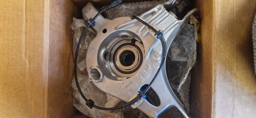 COMPLETE L.H. REAR HUB HOLDER NEW OEM